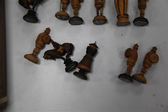 An unusual 19th century Russian figural carved wood chess set,